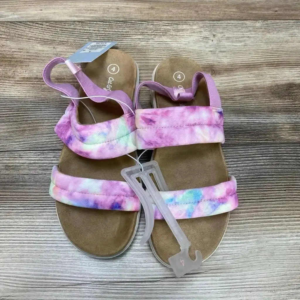 Top-down of purple tie-dye Cat and Jack toddler slip-on sandals size 4Y showing padded straps and suede footbed on wood