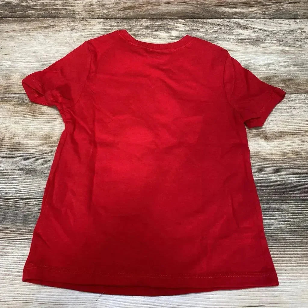 Back view of red Old Navy toddler T-shirt size 5T showing plain back and crew neckline on wood plank background