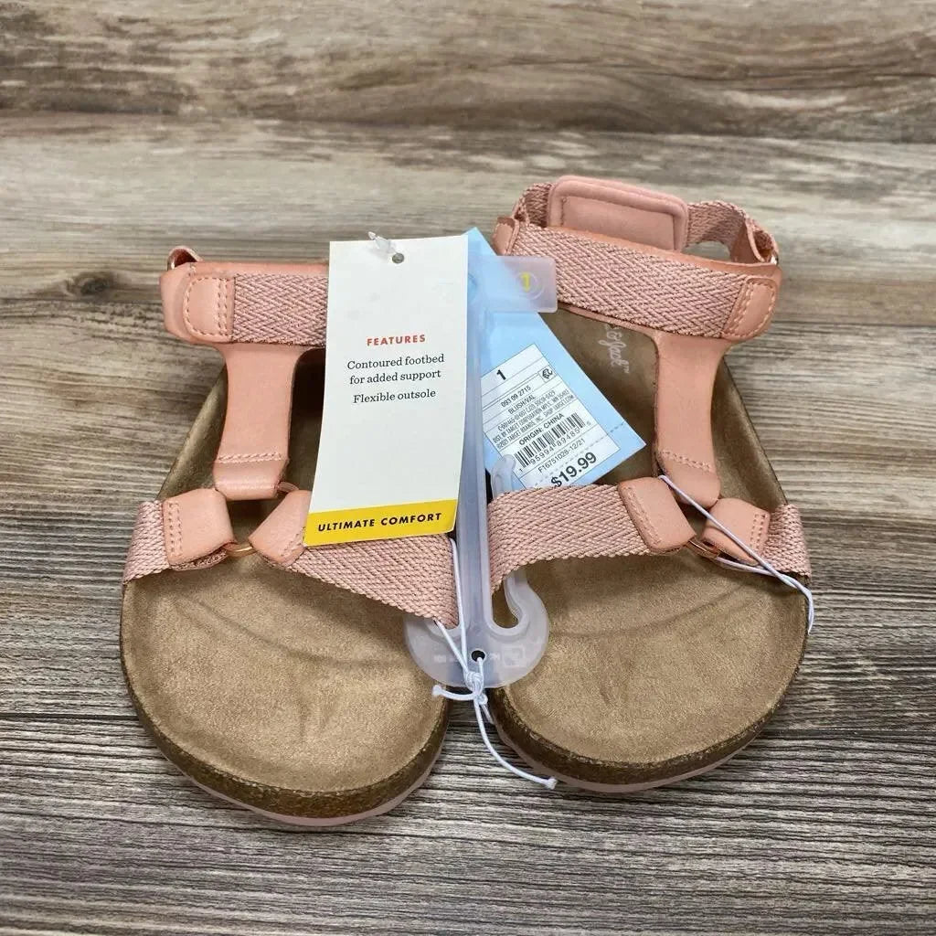 Top view of blush Cat & Jack footbed sandals showing contoured footbed, adjustable straps and price tag on wood background