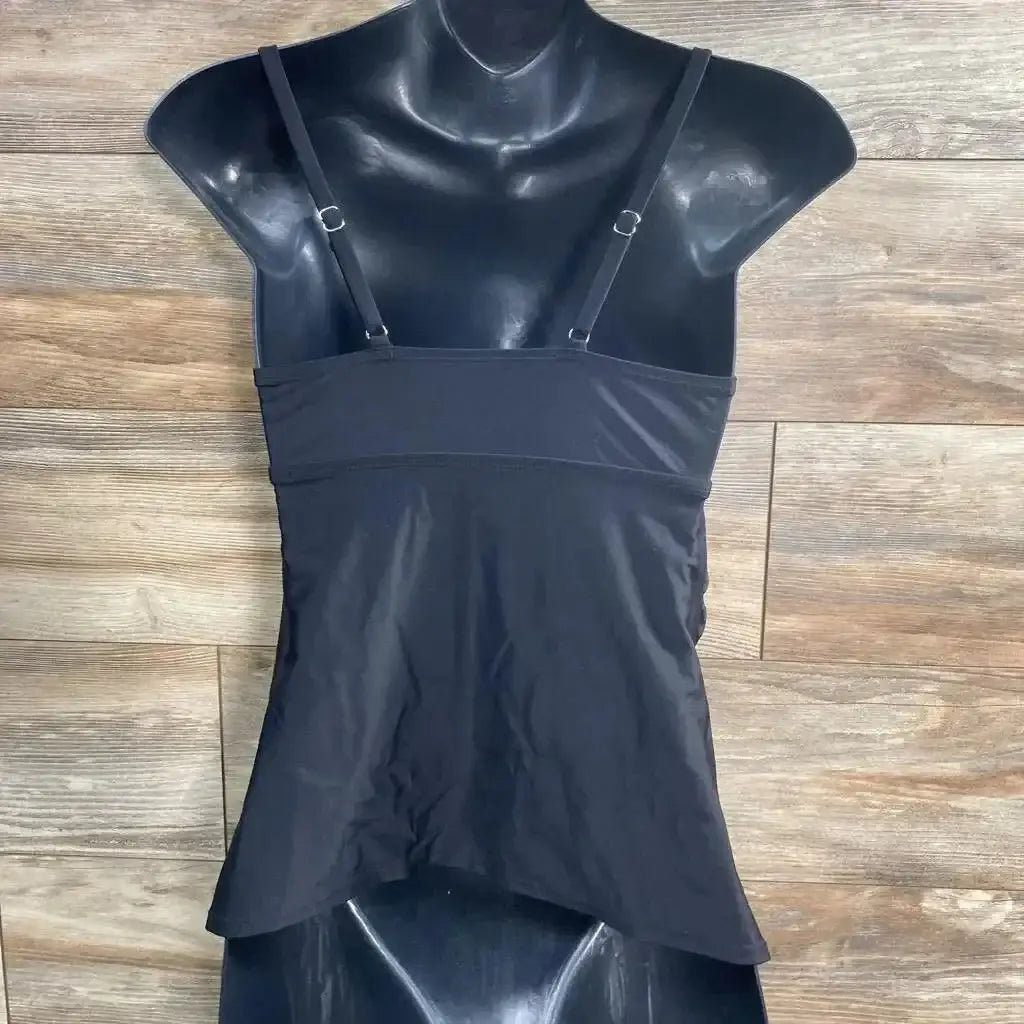 Front view of black Isabel maternity swim tankini top with adjustable straps, empire seam and flared hem on wood background