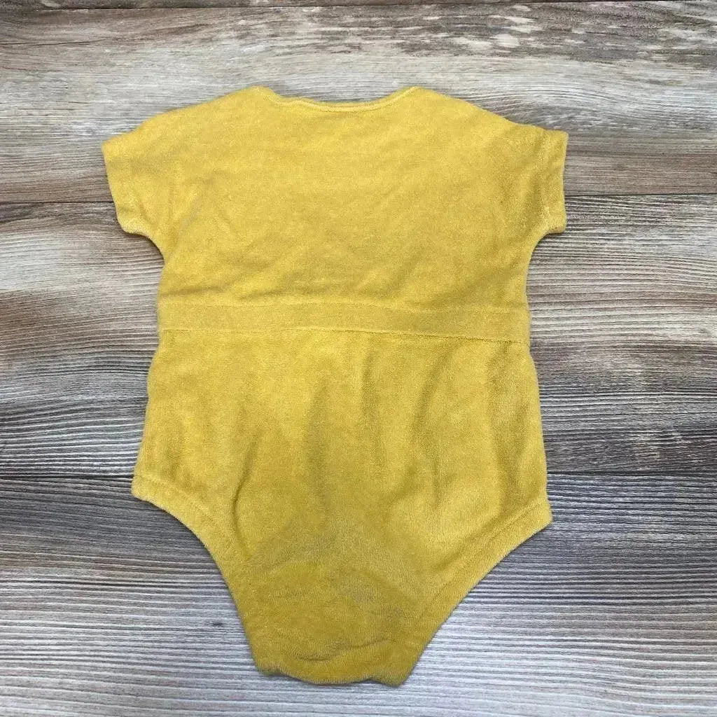 Back of yellow Grayson terry romper, 3-6 months, showing short sleeves and gathered waist on wood background