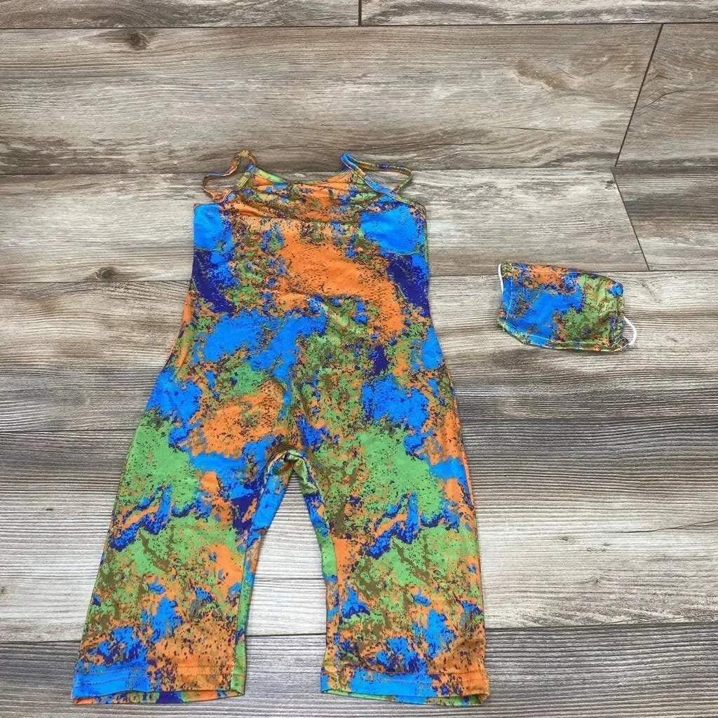 Flat lay of toddler cami romper and matching face mask in orange, blue, and green abstract print, size 4T on wood floor