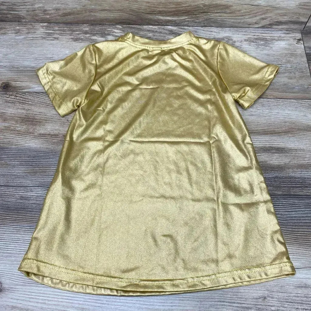 Back view of gold metallic toddler shirt dress (size 2T) showcasing short sleeves and shimmer, flat-laid on wood background