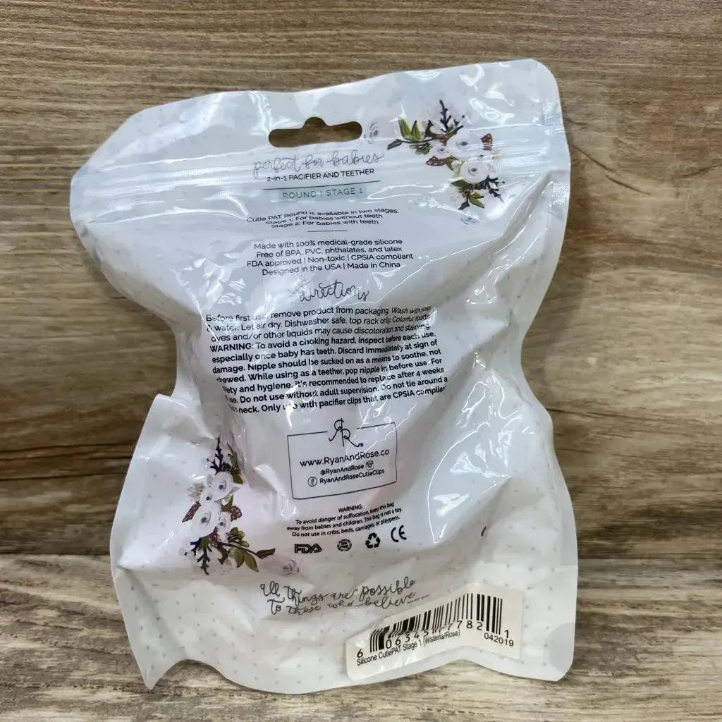 Back of Ryan & Rose Cutie PAT Round Stage 1 2-pack pacifier package with care instructions, barcode and floral design