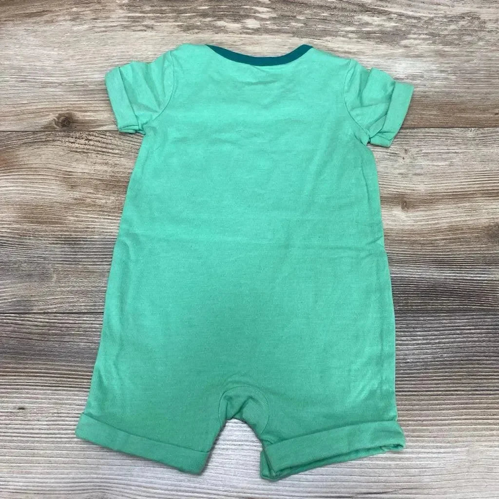 Back flat lay of Cat and Jack Growing Day shortie romper showcasing rolled leg cuffs and teal neck trim on wood floor, green size 3-6m