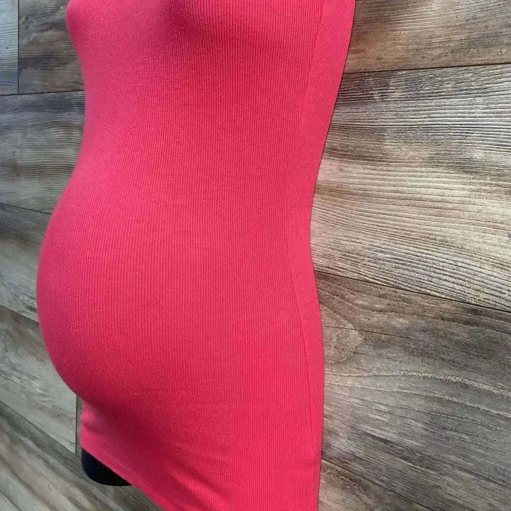 Side view of pink A Pea In The Pod maternity tank top (XS) showing fitted ribbed fabric on a mannequin against a wood-plank background