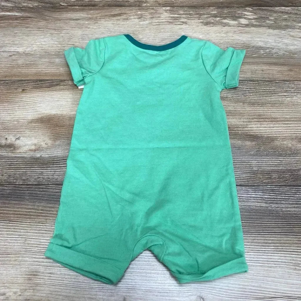 Flat lay back view of green Cat & Jack short sleeve romper with teal neck trim on wood background