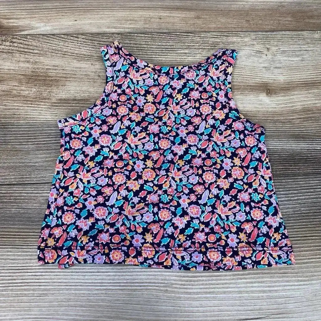 Flat-lay front view of Baby Gap navy tank top size 3-6M showcasing multicolor floral print on wood background