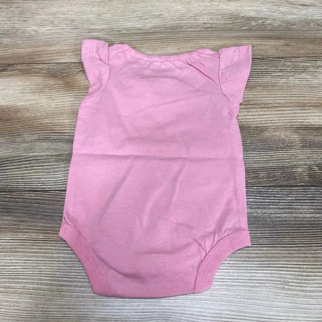 Flat-lay back view of Okie Dokie newborn pink bodysuit showcasing ruffle sleeves on a wood background