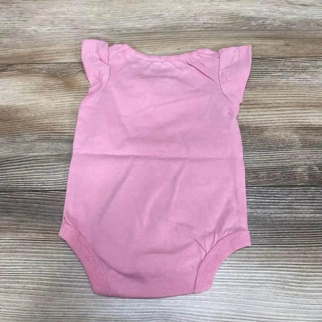 Back view of NEW Okie Dokie Ruffle Sleeve Floral Bodysuit sz NB in solid pink showcasing flutter ruffle sleeves on wood plank background