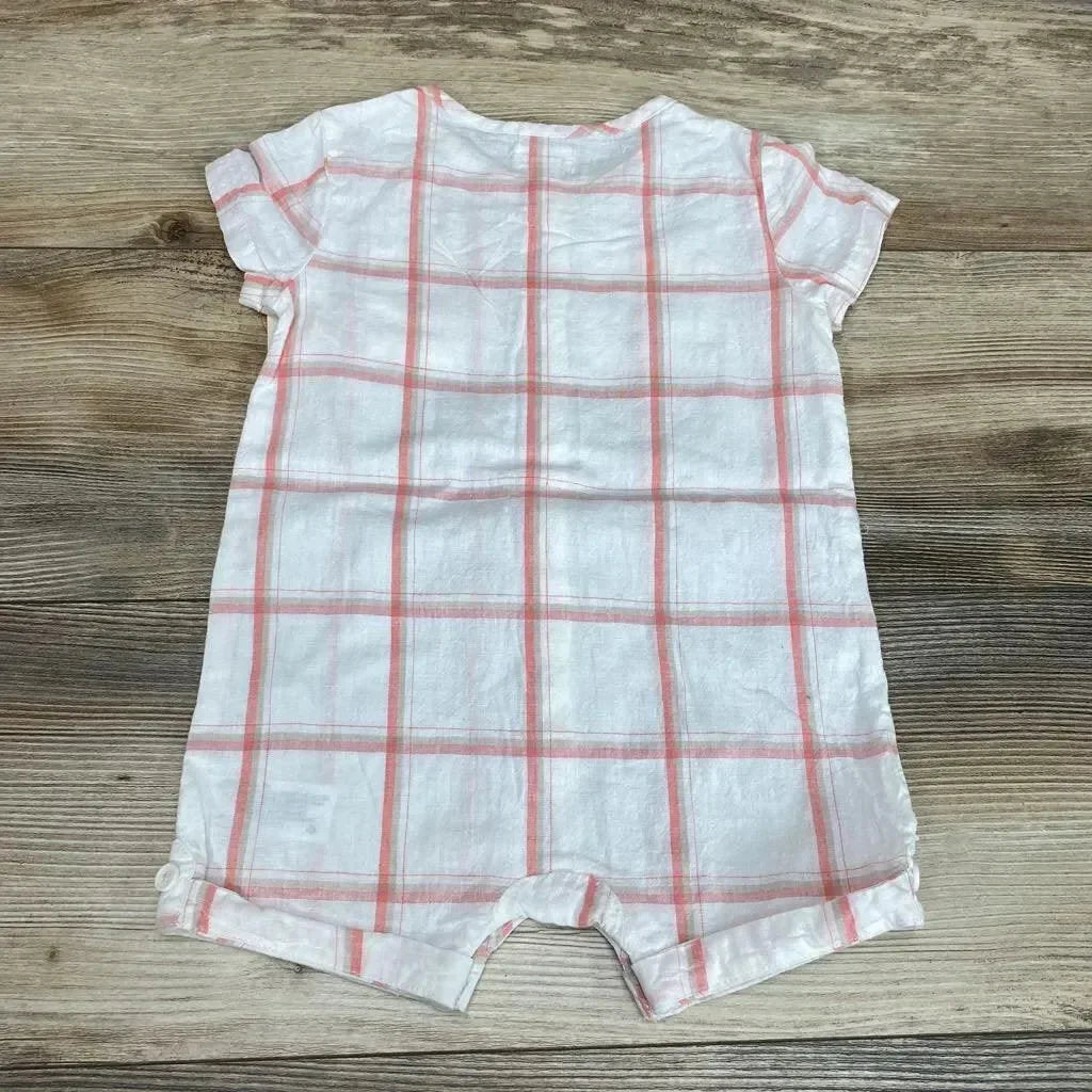 Flat lay of Cat and Jack white pink plaid shortie romper, size 12m, back with cap sleeves and snap crotch on wood background