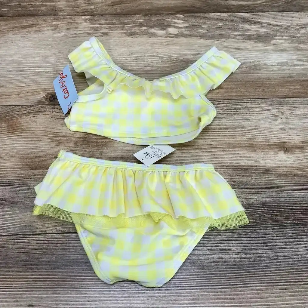 Top view of Cat and Jack 2pc gingham bikini set in size 18m, showcasing yellow and white gingham, ruffled top and skirted bottoms on wood