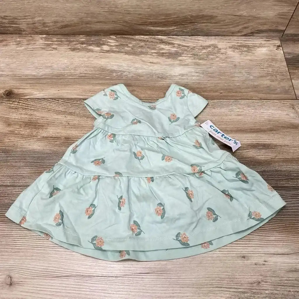 Front view of green floral baby dress with matching bloomers, size 3 months, ruffled sleeves on white background