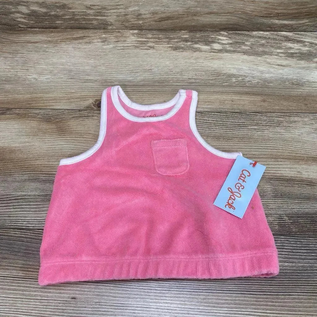 Flat lay of pink Cat & Jack terry cloth baby tank top size 12 months showing small chest pocket and white trim on wood background
