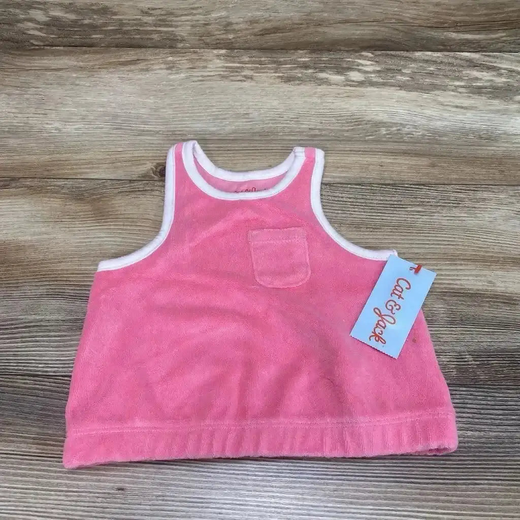 Flat lay of pink Cat & Jack terry cloth baby tank top size 12 months showing small chest pocket and white trim on wood background