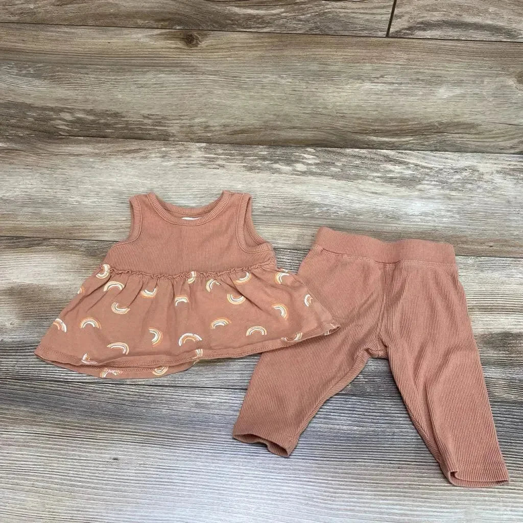 Flat lay of brown ribbed baby tank top with rainbow-print peplum and matching ribbed leggings, 0-3 months, on wood background