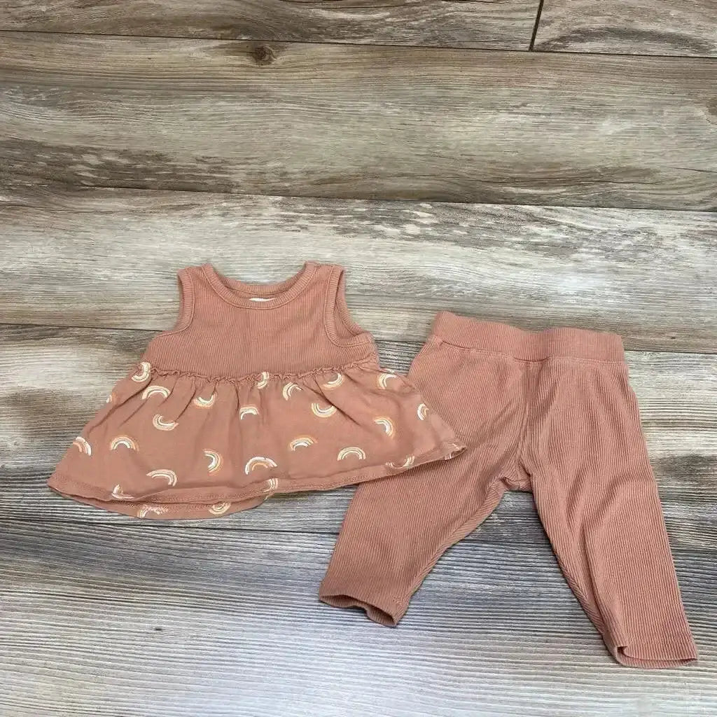 Flat lay of brown ribbed baby tank top with rainbow-print peplum and matching ribbed leggings, 0-3 months, on wood background
