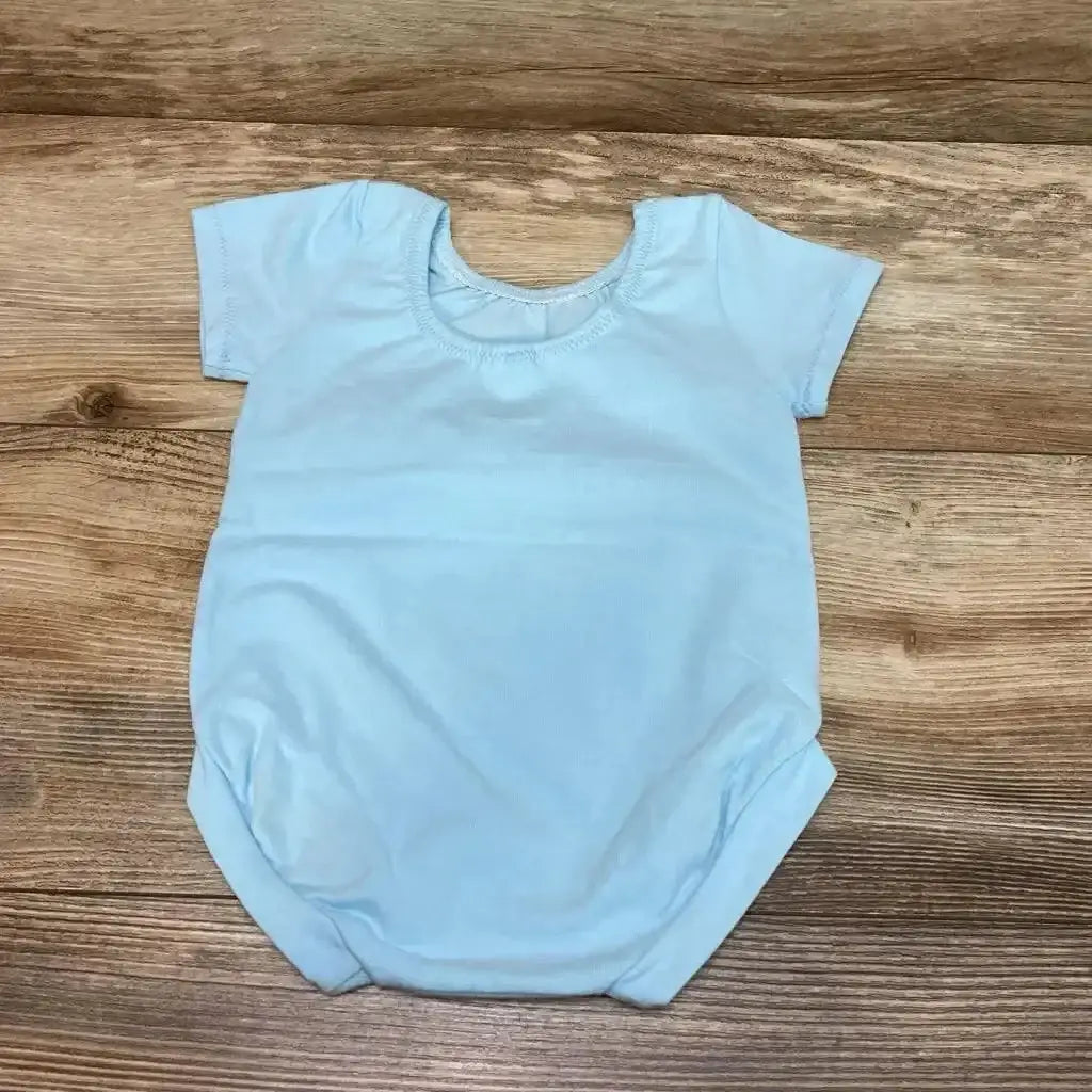 Flat lay of light blue short-sleeve baby bodysuit (12 months) showing round neckline on wood background
