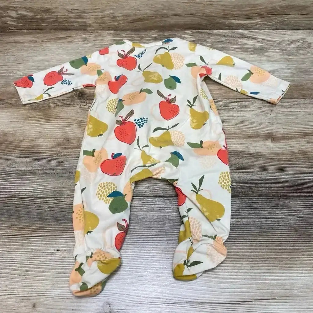Flat lay of beige Mud Pie footed sleeper (0-3 months) showing multicolored fruit print and ruffle trim on wood background