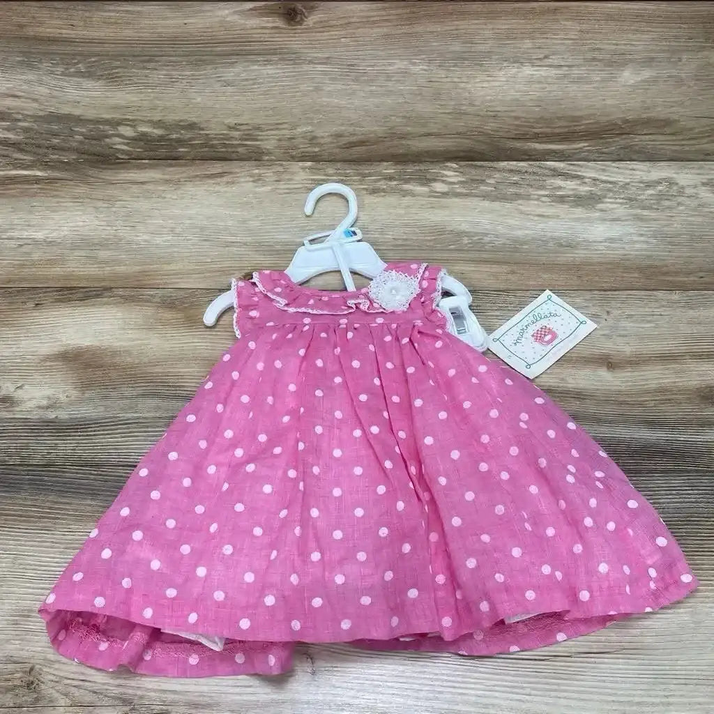 Front view of pink polka dot baby dress with matching bloomers, size 6–9 months, on white background
