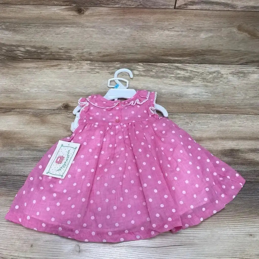 Front view of pink polka dot baby dress with matching bloomers, size 6–9 months, on white background