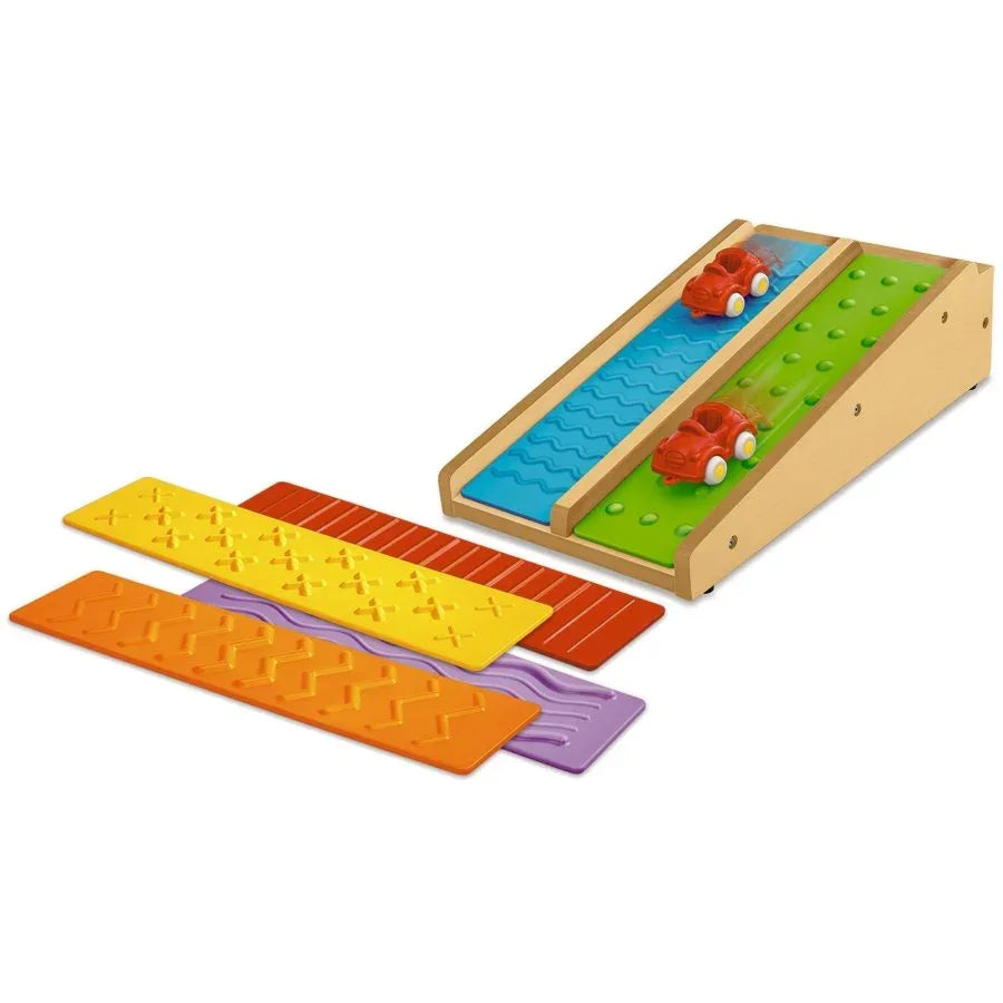 Three-quarter view of NEW Lakeshore Roll and Race Activity Ramp showcasing two red cars dual lanes and four textured insert ramps on white background