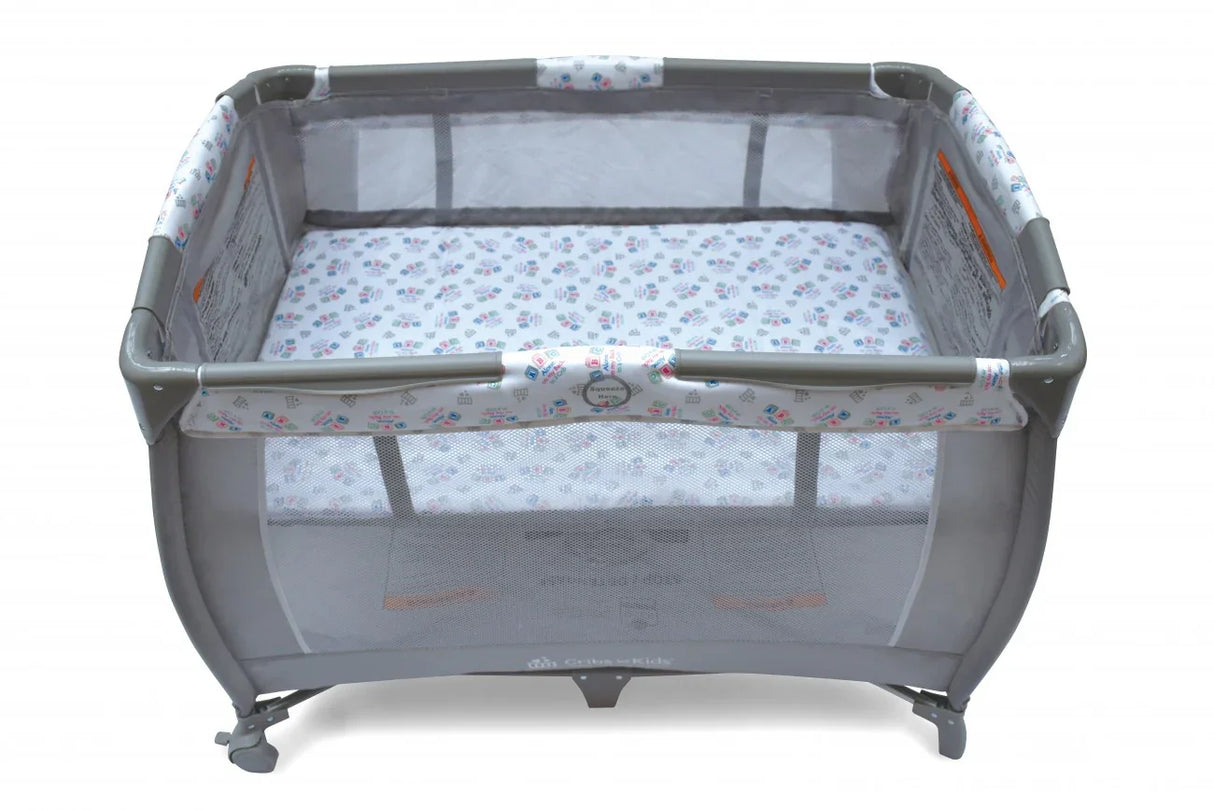 Gray mesh playpen with printed mattress for babies and toddlers