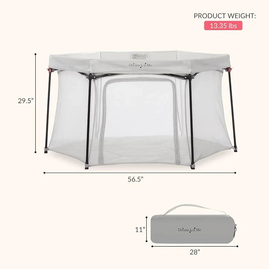 Dream On Me portable play yard, mesh sides, 56.5x29.5 inches, 13.35 lbs, carry bag shown