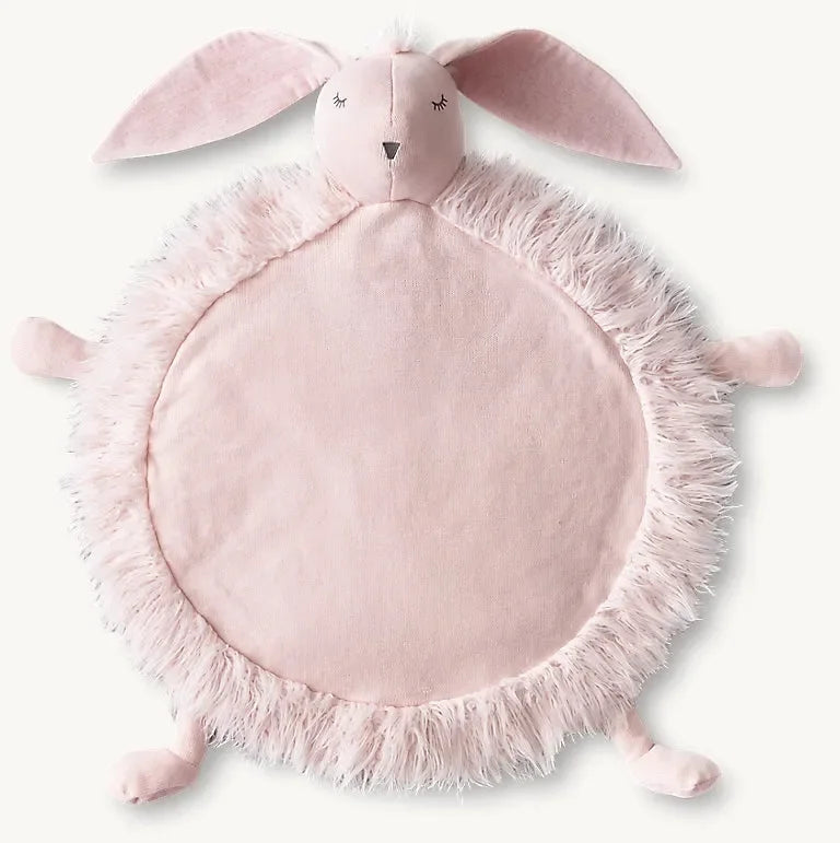 Top-down view of pink Petal Bunny play mat with padded round center, faux-fur trim and attached bunny head