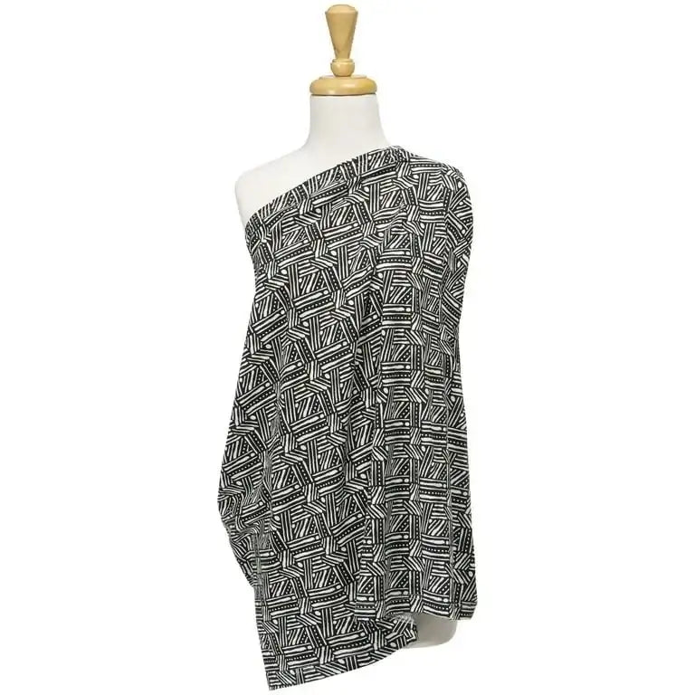 Three-quarter view of Trend Lab nursing cover in black and white geometric tribal print draped over dress form on white background