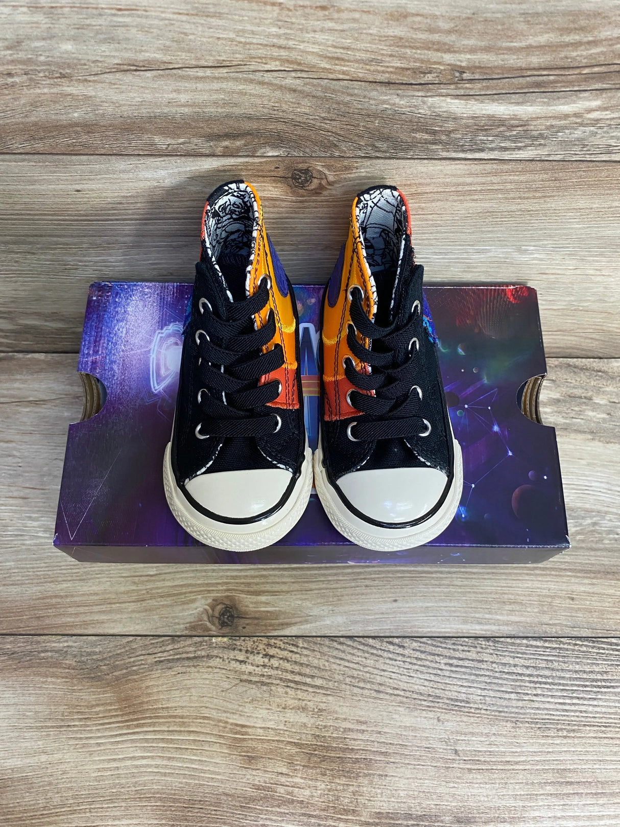 Top view of Converse Chuck Taylor All Star 70 Hi toddler sneakers (5C) showing Space Jam orange/purple panels on shoebox