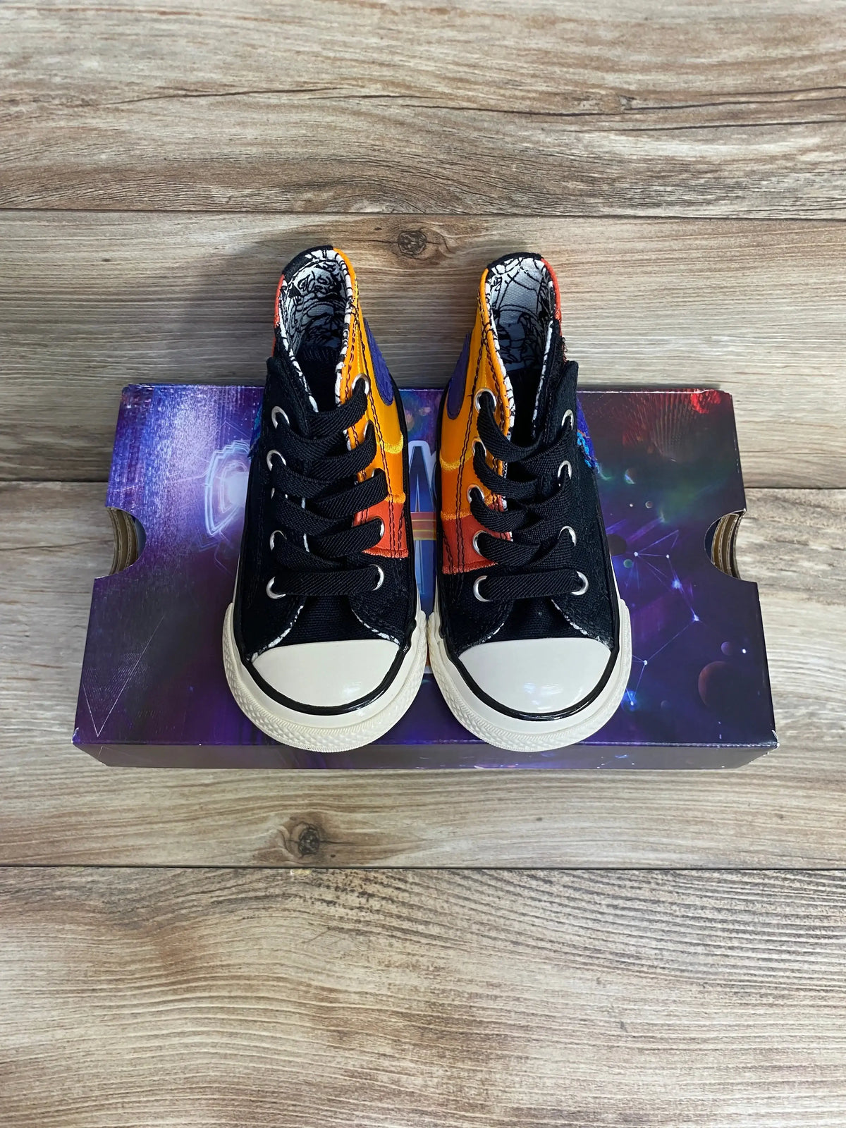 Top view of Converse Chuck Taylor All Star 70 Hi toddler sneakers (5C) showing Space Jam orange/purple panels on shoebox