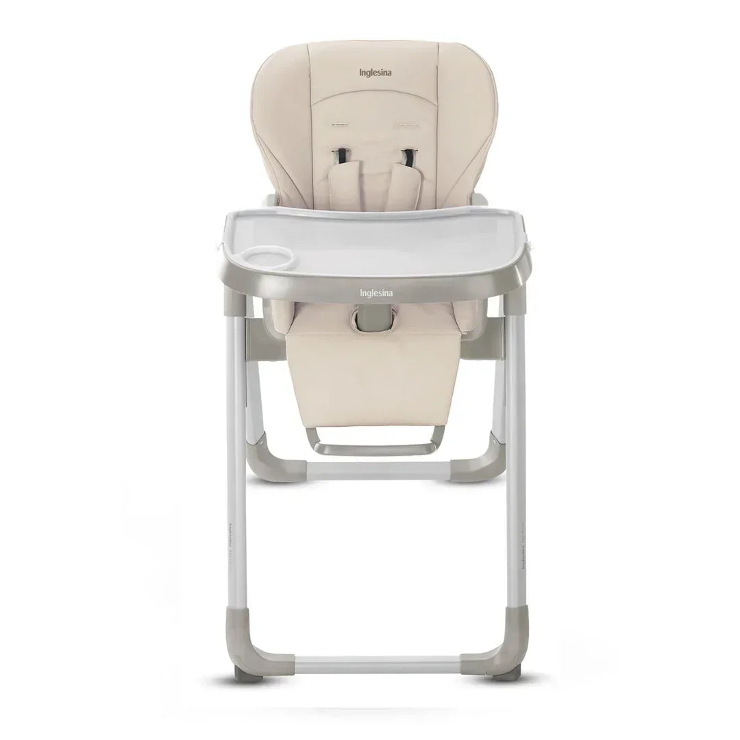 Beige Inglesina high chair with safety straps and tray for kids, ideal for mealtime and children's resale
