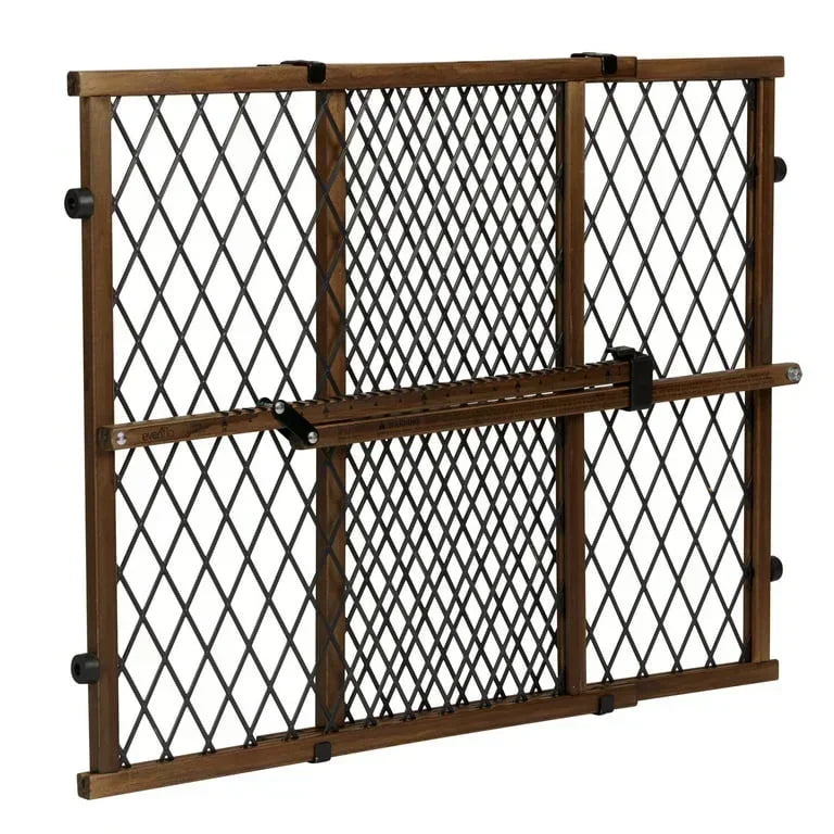Expandable wooden and black metal baby safety gate with diamond pattern mesh for childproofing