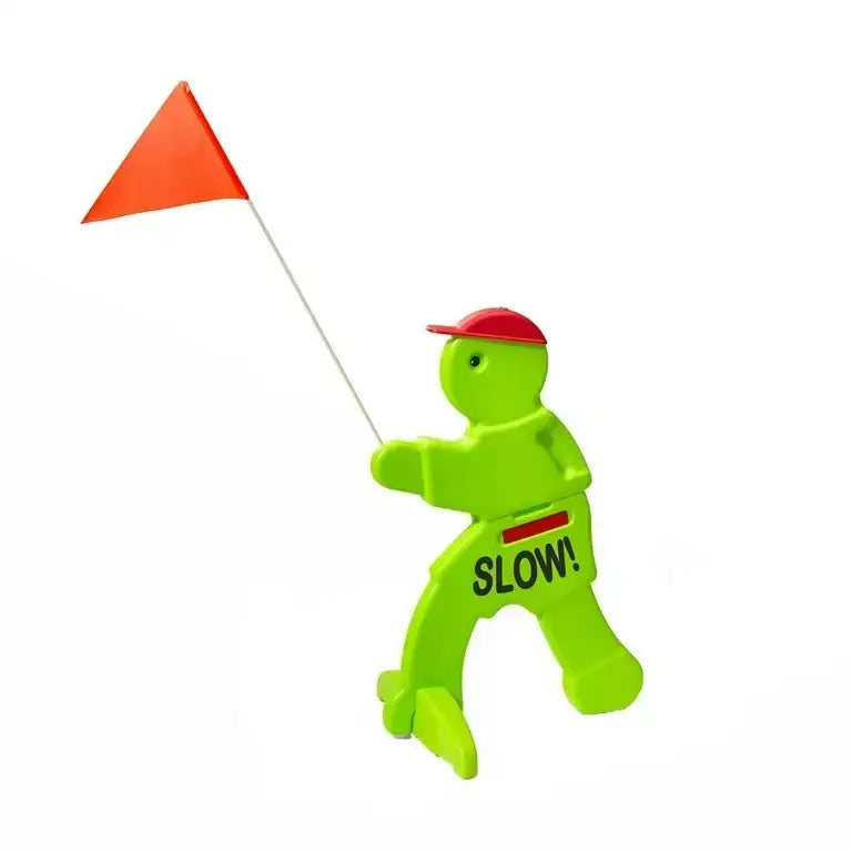 Bright green plastic child safety figure with red cap and orange flag, marked SLOW!, for kids' safety
