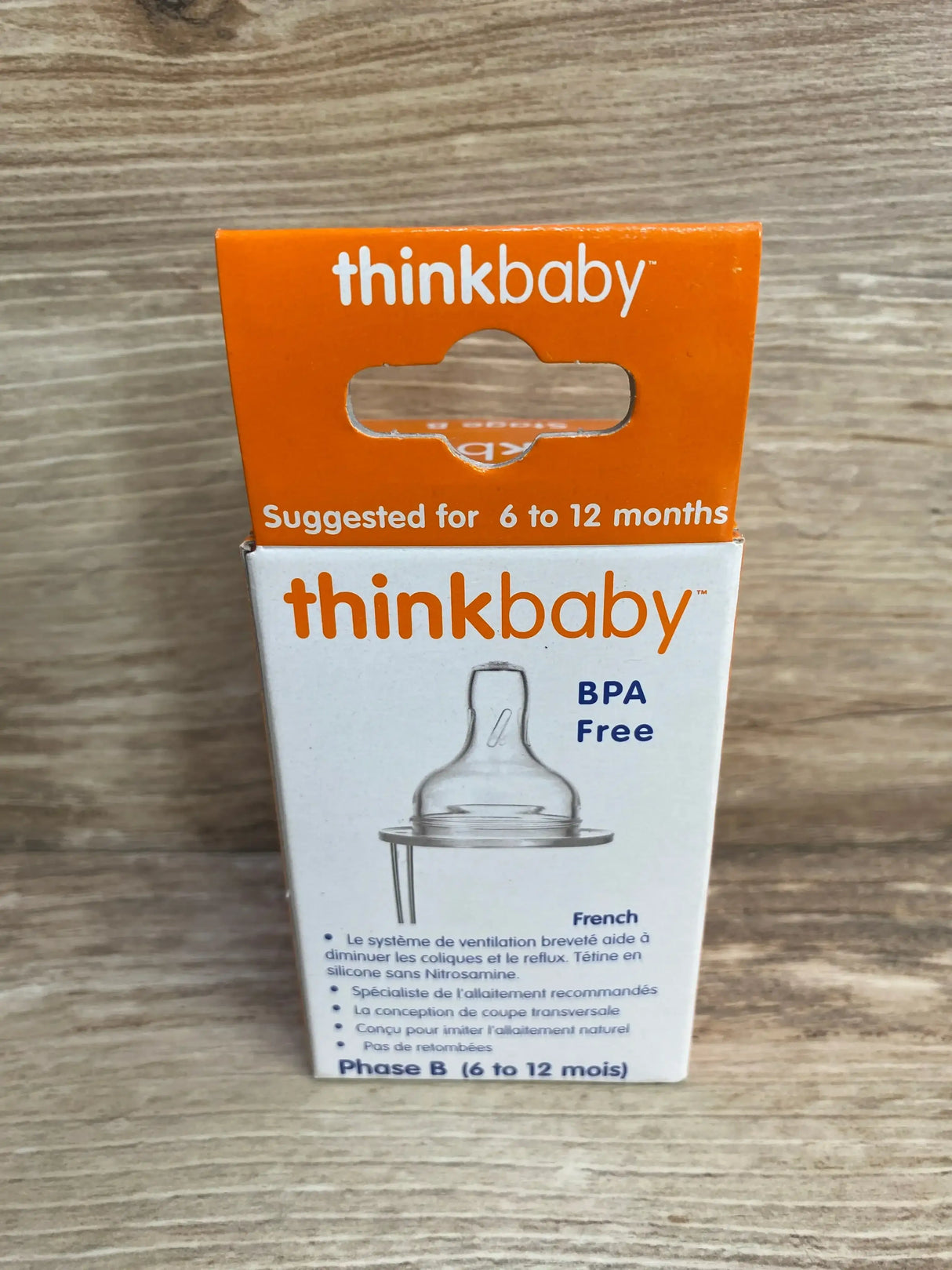 Front view of Thinkbaby Stage B nipple box showcasing venting design with BPA Free label on wood background