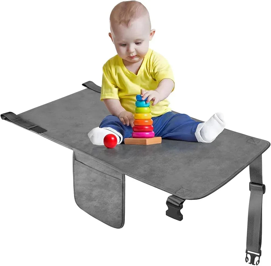 Front view of Cozybonder toddler airplane seat extender with center leg flap, adjustable buckle strap and grey padded surface