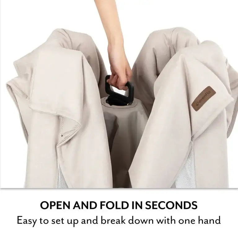 Close-up of the Evenflo Eris playard showcasing one-hand folding with text stating open and fold in seconds