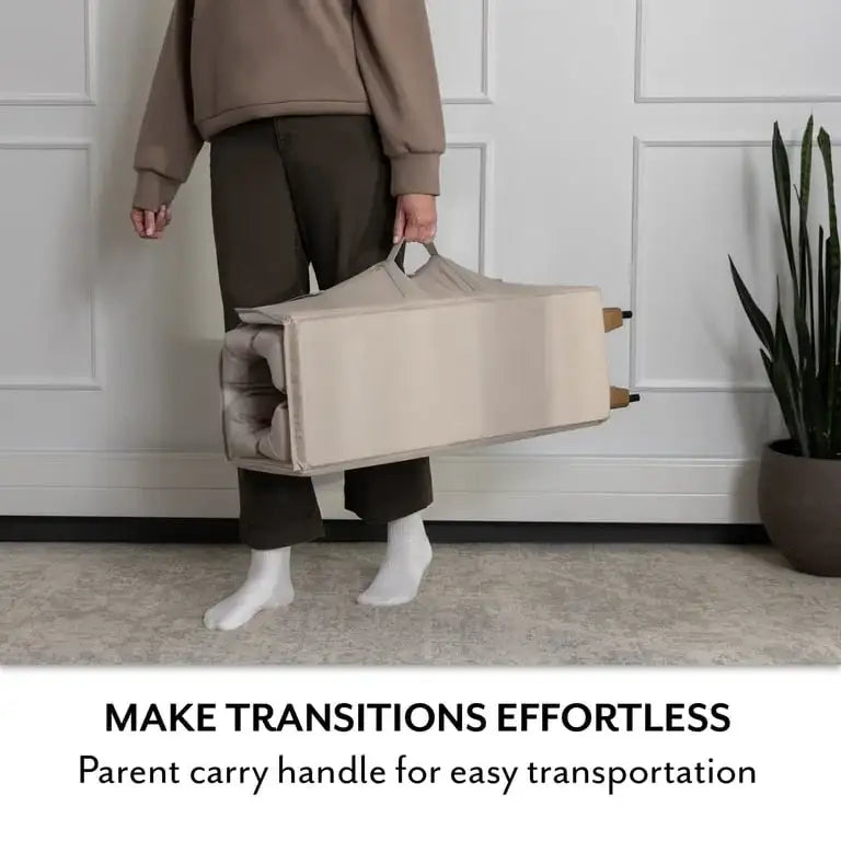 Folded Evenflo Eris One-Hand Playard showcasing parent carry handle for easy transportation, making transitions effortless