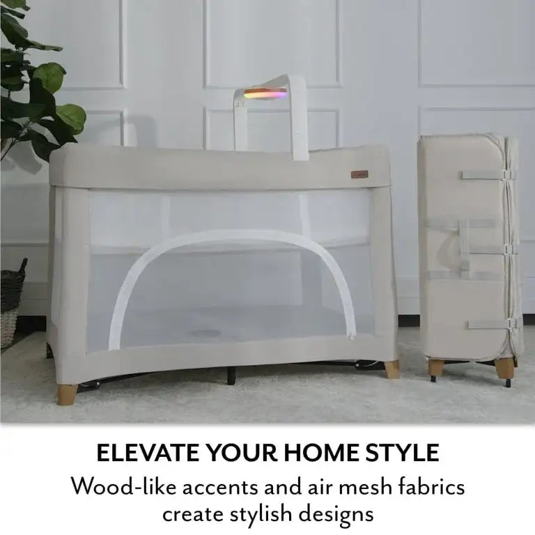 Front view of Evenflo Eris One-Hand Playard with Bassinet in Coastal Coffee showcasing wood-like accents and air mesh fabrics