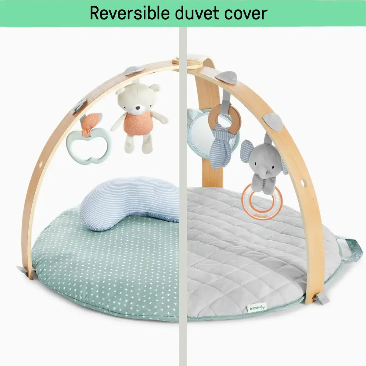 Front view of Ingenuity Cozy Spot activity gym with reversible duvet cover, two prints, and hanging toys