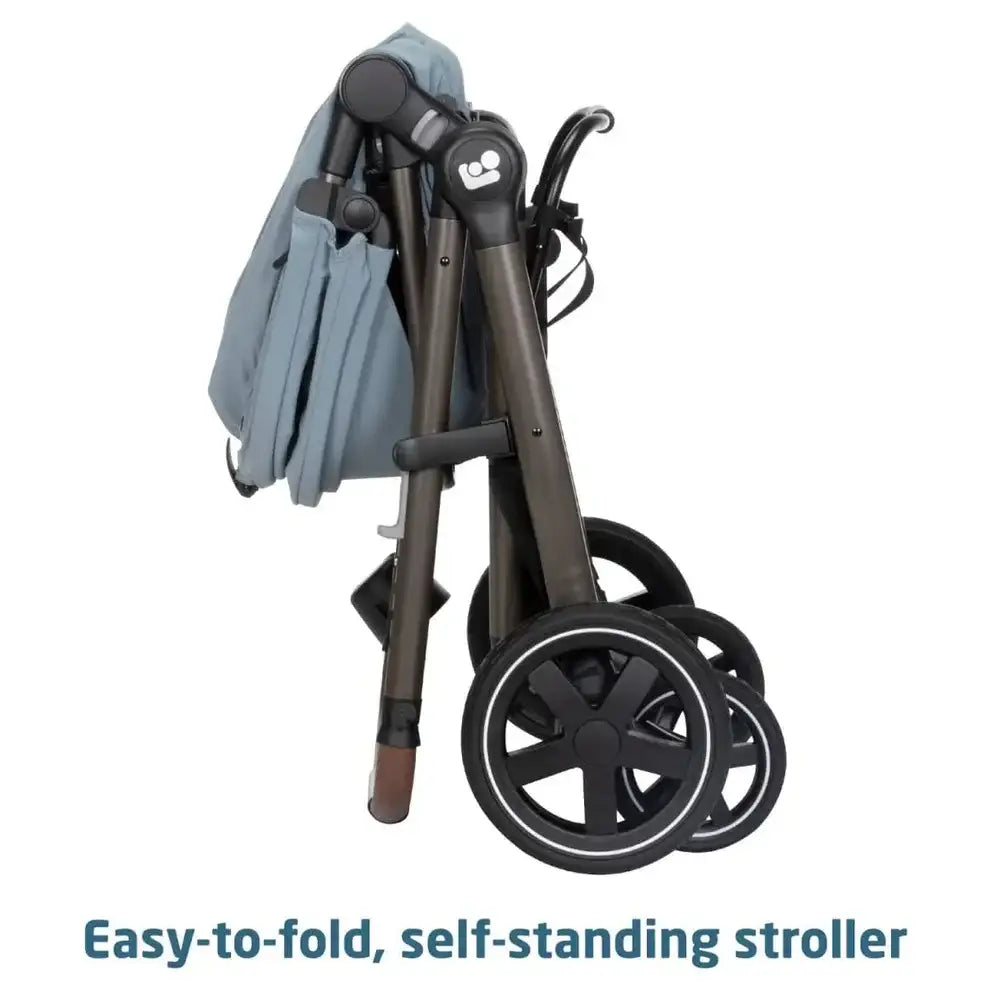 Folded Maxi-Cosi Zelia 2 Luxe stroller in New Hope Grey showcasing its easy-to-fold, self-standing design