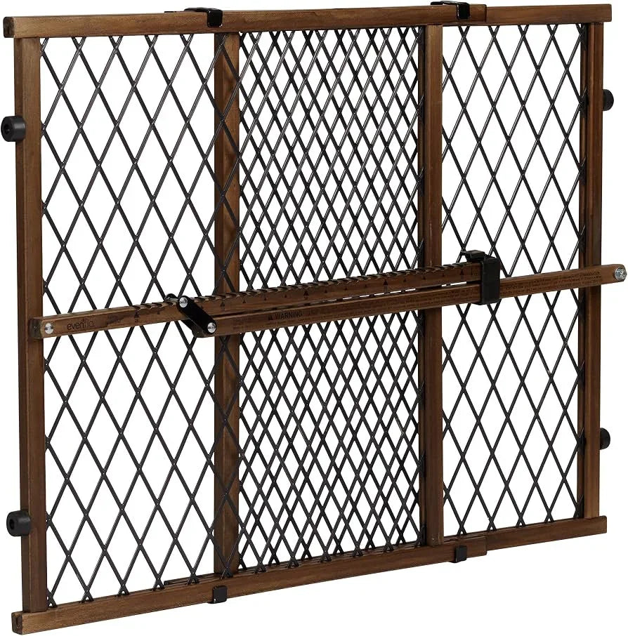 Front view of Evenflo doorway gate with farmhouse wood frame, diamond metal mesh, center lock bar, white background