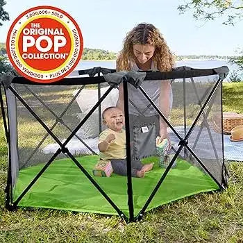Bright Starts Pop 'N Play green indoor/outdoor playard with a baby and woman outdoors.