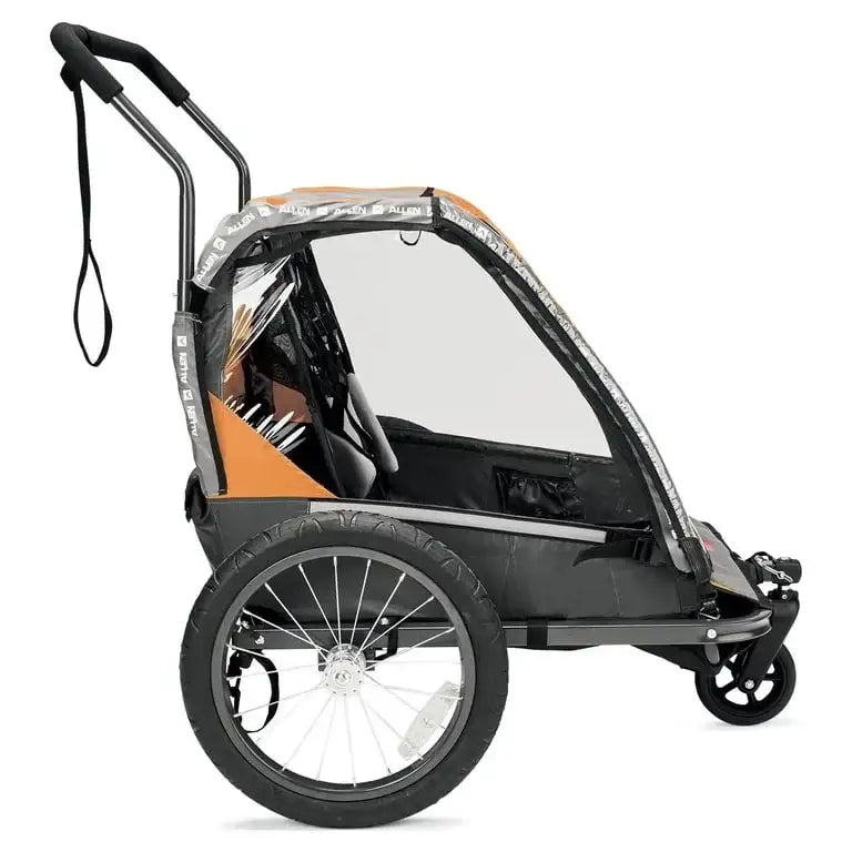 Side view of Allen Sports 2-in-1 bike trailer and stroller showcasing orange canopy, clear rain cover, large spoked wheels, and stroller handle on white background