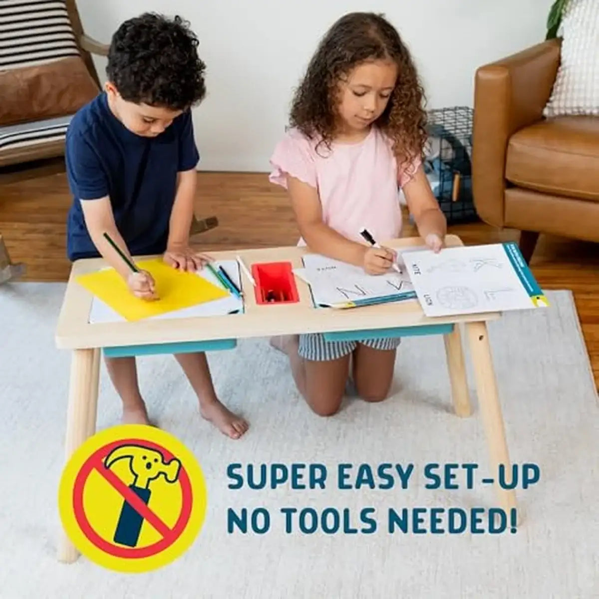 Two children draw and color at the sensory table art desk with super easy setup and no tools needed