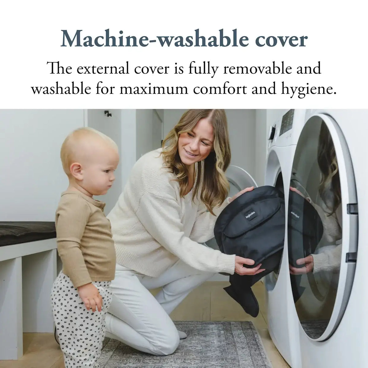 Woman removing a navy Inglesina Fast Table Chair cover for machine washing with a baby nearby.