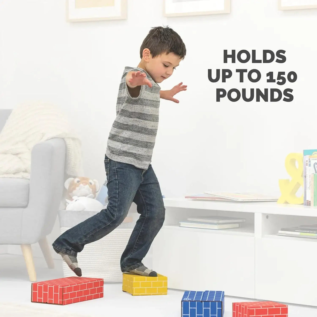 Front view of Bankers Box Heavy Duty Jumbo Cardboard Building Blocks 74ct with child standing on them, holds up to 150 pounds