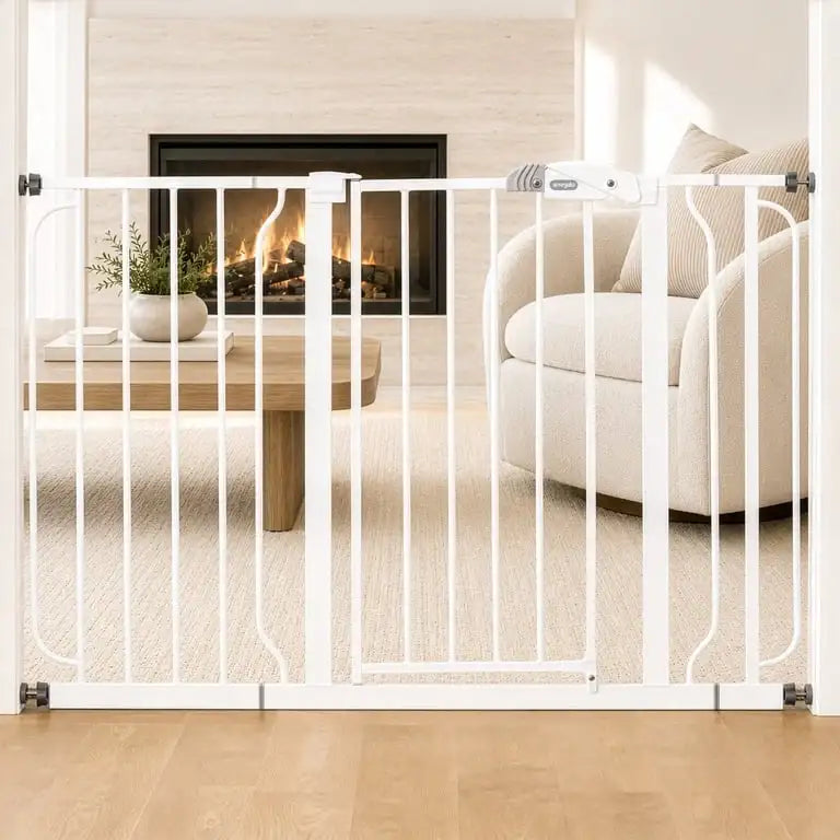 Front view of Regalo Extra Wide Safety Gate showing white frame and central latch across a doorway with fireplace behind it