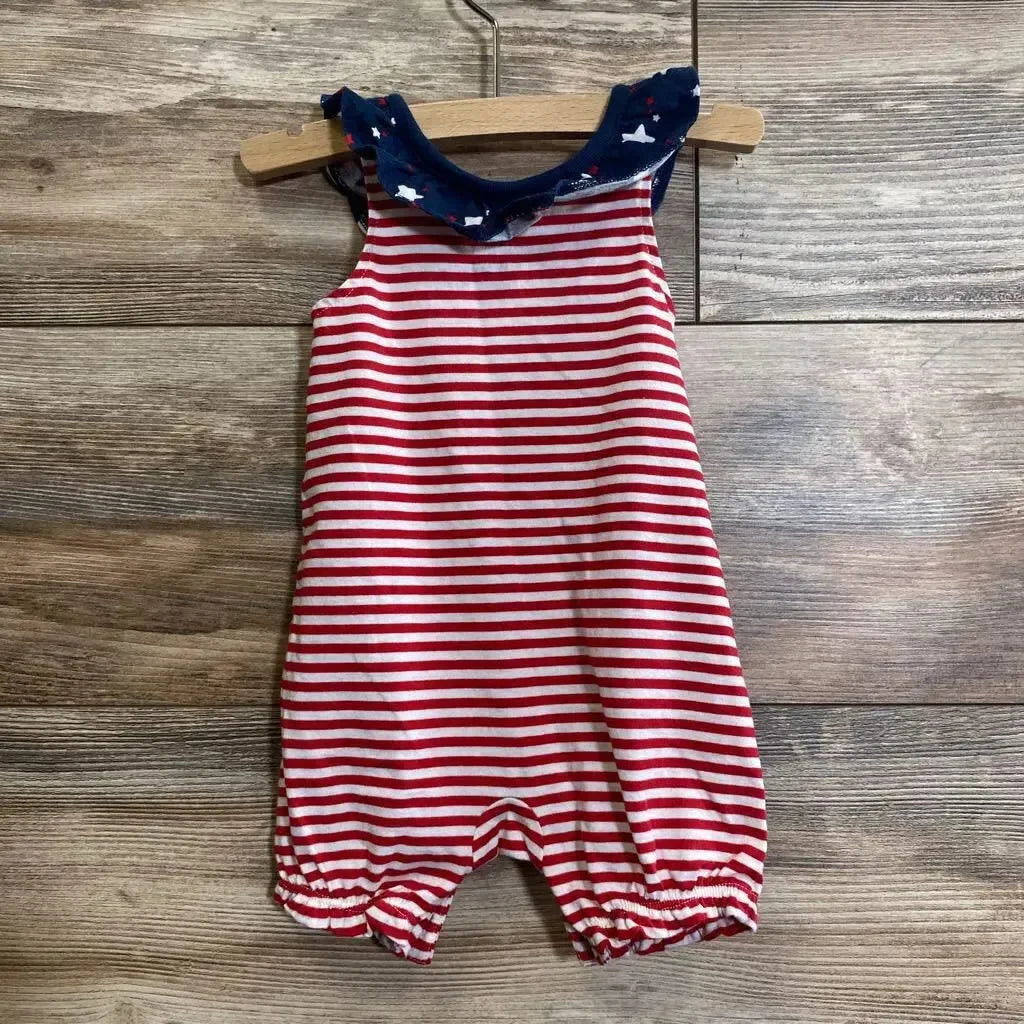 Front view of sleeveless red-and-white striped romper (0-3M) with navy ruffled star collar on wood floor